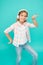 Dance folk dances. Girl child listen music with modern headphones. Kid little girl listen music headphones. Music