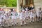 Dance group of young children dancers perform at a children\'s party in front of the audience dressed as penguins and birds