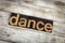 Dance Letterpress Word on Wooden Background