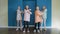 Dance quartet of four girls dancing in blue studio front camera. Dancer teenager girls dancing in dance studio. Dancer