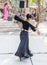 Dancer in a black authentic dress dances to the music for visitors at the annual festival `Jerusalem Knights`