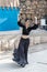 Dancer in a black authentic dress dances to the music for visitors at the annual festival `Jerusalem Knights`