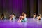 Dancer girls sit on stage, dramatic dance