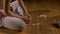 Dancer takes off her ballet shoes and rubs her feet