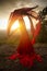 Dancer throwing red fabric into the wind in Connecticut