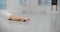 Dancer warms up her legs before rehearsal on the floor of white dance hall, ballet dancer, ballerina in the ballet