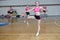 Dancers shows off their moves - pirouette, girls in black and pink sportswear train at the gym, sport young woman rotates on one