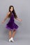 dancewear fashion clothes. happy teen girl junior ballroom dancer. child in purple dance dress.