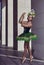 Dancing Ballet Ideas. Winsome Professional Caucasian Ballet Dancer in Green Tutu Dress Posing On Dancing Pose While Wearing