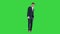Dancing businessman in black suit on a Green Screen, Chroma Key.