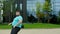 Dancing funny obese guy beside of a big modern building he wearing yoga outfit he are very excited and charismatic. Shot