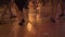 Dancing legs at dance floor at party in night club. People dancing and having fun at dance hall in restaurant. Active