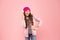 Dancing and singing. Free music apps for mobile device. Energetic playlist. Girl cute schoolgirl pink clothes headphones