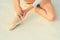 Dancing on toes. Lacing ballet slippers. Female feet in pointe shoes. Ballerina shoes. Ballerina legs in white ballet