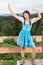 Dancing and waving Knitting bavarian girl in the dirndl