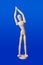 Dancing wooden toy figure on blue