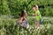 Dandelion field white girl boy happy little baby green meadow yellow flowers dandelions nature park garden two family sister broth