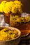 Dandelion flower healthy tea in glass cup on table. Herbal medicine Delicious tisane tea from with fresh yellow blossom