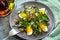 Dandelion salad with eggs and bacon