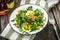 Dandelion salad with eggs and bacon