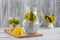 Dandelion tisane tea with fresh yellow blossom inside tea cup, on wooden table