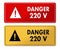 Danger 220V warning panels in French translation