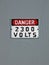 Danger 2300 volt, text on vintage wall,