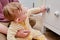 Danger for the baby to pinch the hand of the cabinet door or chest of drawers. Protect children from home furniture, kids safety