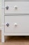 Danger for the baby to pinch the hand of the cabinet door or chest of drawers. Protect children from home furniture, kids safety