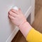 Danger for the baby to pinch the hand of the cabinet door or chest of drawers. Protect children from home furniture, kids safety