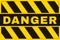 Danger Banner. Yellow and Black Safety Background. Worn and Grunge Warning Wallpaper