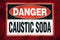 Danger Caustic Soda placard in red white and black