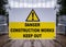 Danger construction site keep out modern clean yellow sign with triangle exclamation mark attached to metal compound fence around