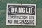 Danger, construction site, no trespassing as warning message,