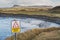 Danger deep drop sign and Rosses point beach, Benbulben flattop mountain in county Sligo, Ireland, Winter season, top covered with