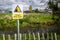 Danger Deep Water warning sign by rural waterway river hazard. Risk of falling in and drowning.