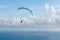 Danger extreme flying tandem paraglider over the sea