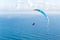 Danger extreme flying tandem paraglider over the sea