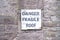 Danger fragile roof sign on wall at farm house