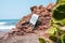 Danger, huge rocks and waves sing written in Spanish at Las Penitas beach in Leon Nicaragua.