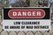 Danger - Low Clearance - Be Aware of MAD Distance sign. The 269 standard identifies required Minimum Approach Distances