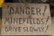 Danger!Minefields!Drive slowly!