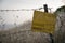 Danger mines - yellow warning sign next to a mine field, close to the border with Syria, in the Golan Heights, Israel