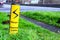 Danger overhead cables warning sign next uk motorway in england