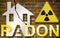 The danger of radon gas in our homes - concept with an outline of a small house with radon text against a damaged cracked brick