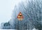 Danger Reindeer Road sign in countryside road snowy winter Lapland