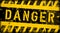 Danger and risk warning signage or computer virus sign, worn and grungy, vector