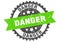 danger round grunge stamp. danger