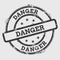 Danger rubber stamp isolated on white background.