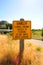 Danger sign on a gold dry grass Zoom Burst Photography